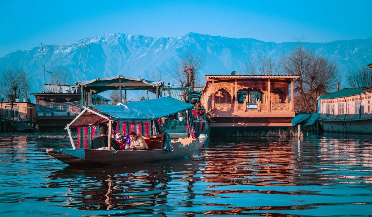 Traditional houseboat on Dal Lake Srinagar Kashmir with mountain views